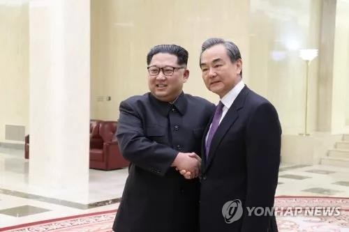北중앙통신 "김정은, 왕이 접견…폭넓고 깊은 의견 교환"