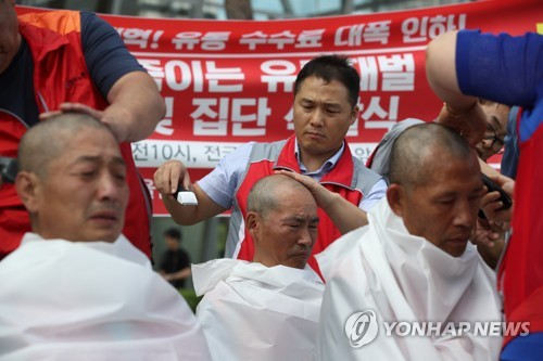 "30만원 구두 1켤레 만들면 7000원 수입"…제화노동자 삭발시위