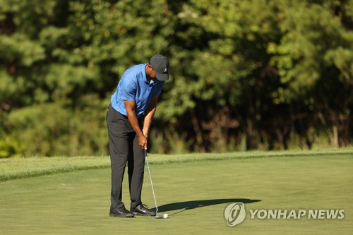 '냉찜질'에 떠오른 부상주의보…우즈 "오일 때문에 뜨거워서"