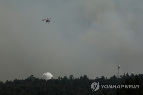 화마 피한 116년 역사 미 윌슨천문대 "물 한방울까지 동원"