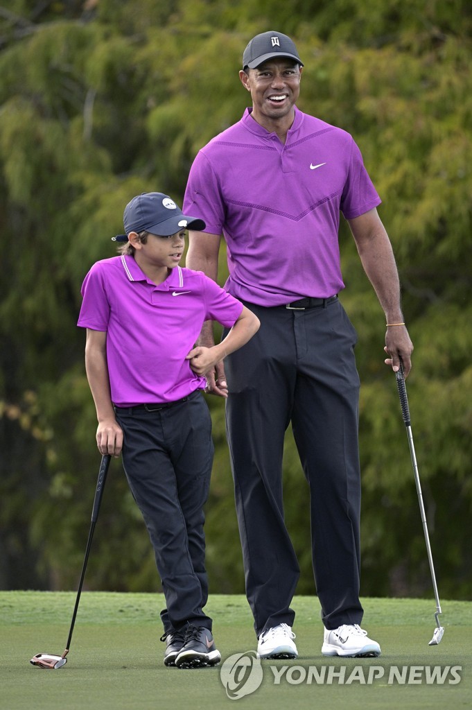 'Perfect Eagle', 11-year-old son Charlie, who looks like Woods, makes his dad laugh