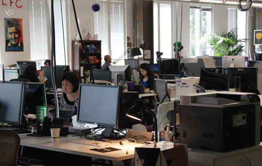 This May 11, 2012, photo shows workers at the Facebook office in Menlo Park, Calif.  The company Mark Zuckerberg created as a Harvard student eight years ago is preparing for what looks to be the biggest Internet IPO ever. (AP Photo/Jeff Chiu)