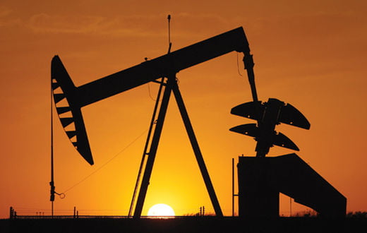 A pumpjack is silhouetted against the setting sun in Oklahoma City, Tuesday, March 22, 2011. (AP Photo/Sue Ogrocki)