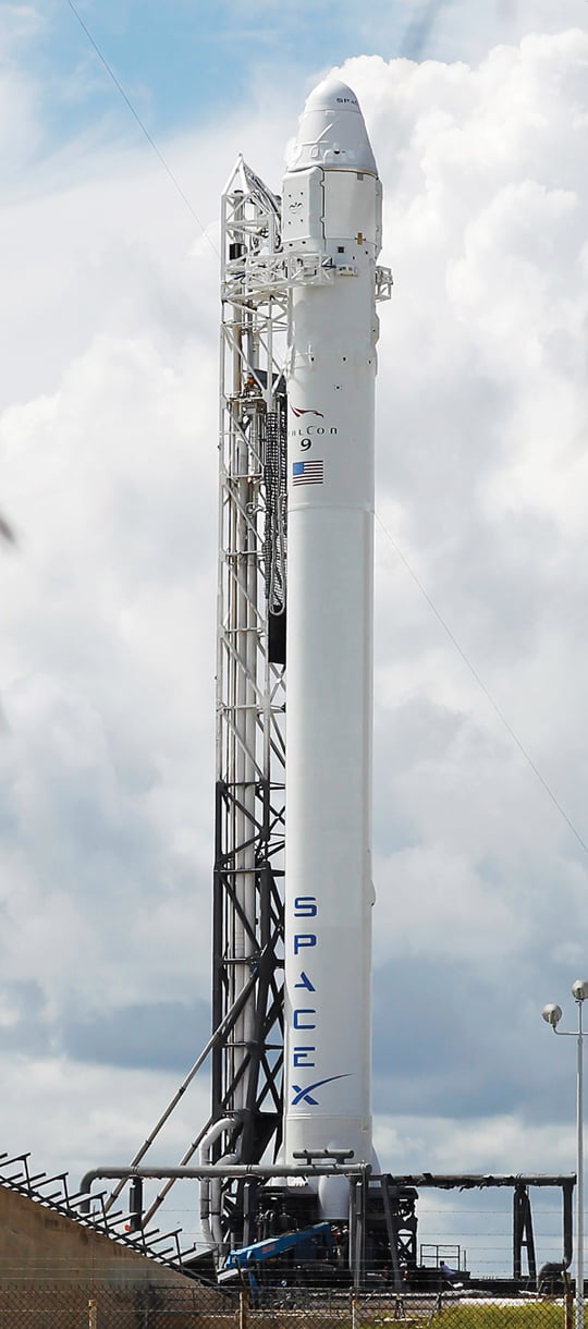 The Falcon 9 SpaceX rocket stands on space launch complex 40 ready for launch at the Cape Canaveral Air Force Station in Cape Canaveral, Fla. on Sunday, Oct. 7, 2012. Launch is scheduled for 8:35 PM Sunday on a supply mission to the International Space Station. (AP Photo/Terry Renna)