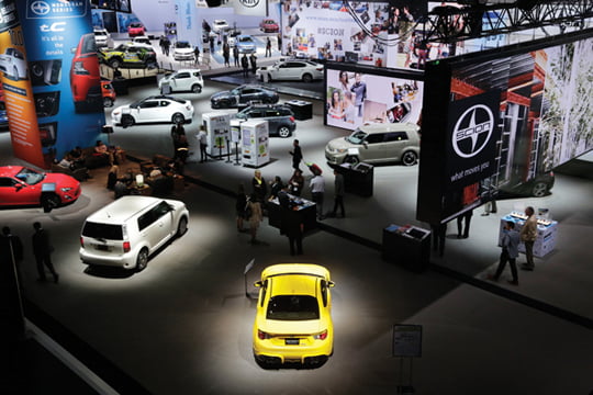 Cars from Toyota's Scion brand, foreground, are part the New York International Auto Show, Thursday, April 17, 2014 in New York. (AP Photo/Mark Lennihan)