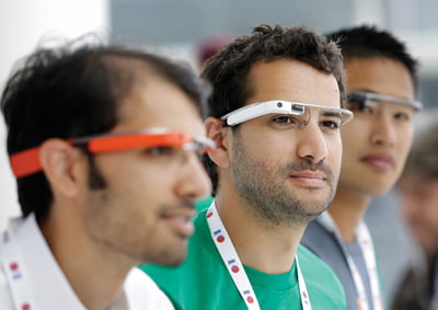 Google Glass team members wear Google Glasses at a booth at Google I/O 2013 in San Francisco, Wednesday, May 15, 2013. (AP Photo/Jeff Chiu)