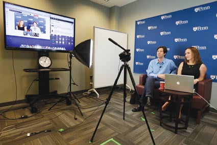 ADVANCE FOR MONDAY JUNE 24, 2013-  In this Thursday, May 30, 2013, photo, University of Pennsylvania professor Peter Struck, accompanied by teaching assistant Cat Gillespie, teaches a mythology class during a live recording of a massive, open, online classes (MOOC), in Philadelphia. Pressure to cut costs and “scale up” teaching has helped pave the way for the popularity of MOOCs, or “Massive Open Online Courses” taught by elite universities.  (AP Photo/Matt Rourke)