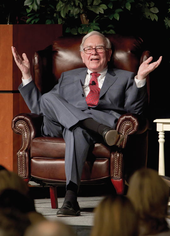 Billionaire investor Warren Buffett speaks in Omaha, Neb., Monday, Nov. 14, 2011 at an event to raise money for the Girls Inc., charity organization. Buffett, Chairman and CEO of Berkshire Hathaway, said his company bought about $10.7 billion of IBM stock this year, giving him a stake of more than 5 percent stake in the technology company. (AP Photo/Nati Harnik)