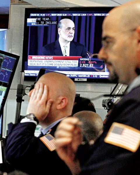 Federal Reserve Chairman Ben Bernanke is visible on a television monitor on the floor of the New York Stock Exchange, Wednesday, June 20, 2012. Bernanke said the Fed took a significant step Wednesday when it agreed to extend a program to swap short-term bonds for longer-term bonds. (AP Photo/Richard Drew)