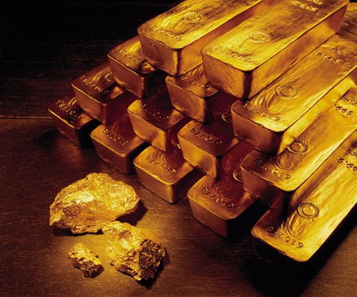 FILE - In this undated handout file photo from Newmont Mining Corporation, gold nuggets and bars are shown.  In December 2007, gold for about $840 an ounce. A little over a year later, it rose above $1,000 for the first time. It climbed gradually for the next two years. Then in March 2011, it began rocketing up. On Tuesday, Aug. 16, 2011, it traded at $1,788 an ounce, up 26 percent this year. (AP Photo/Newmont Mining, File )