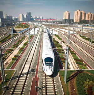 A CRH high-speed train leaves the Beijing South Station for Shanghai during a test run on the Beijing-Shanghai high-speed railway in Beijing, China, Monday, June 27, 2011. China's bullet train builders have conducted a test run of their showcase Beijing-to-Shanghai line amid controversy over the system's high cost. (AP Photo/Alexander F. Yuan)