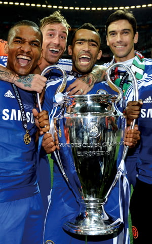 MUNICH, GERMANY - MAY 19:  Florent Malouda  Paulo Ferreira,  Raul Meireles and  Jose Bosingwa  of Chelsea celebrate with the trophy following their team's victory at the end of the UEFA Champions League Final between FC Bayern Muenchen and Chelsea at the Fussball Arena M?nchen on May 19, 2012 in Munich, Germany.  (Photo by Darren Walsh/Chelsea FC via Getty Images)