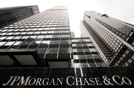 A JPMorgan office building is shown, Monday, May 14, 2012, in New York. JPMorgan Chase, the largest bank in the United States, said Thursday that it lost $2 billion in the past six weeks in a trading portfolio designed to hedge against risks the company takes with its own money. (AP Photo/Mark Lennihan)