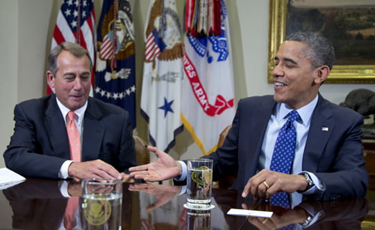 President Barack Obama reaches to shakes hands with House Speaker John Boehner of Ohio, in the Roosevelt Room of the White House in Washington, Friday, Nov. 16, 2012, during a meeting of the bipartisan, bicameral leadership of Congress to discuss the deficit and economy. (AP Photo/Carolyn Kaster)