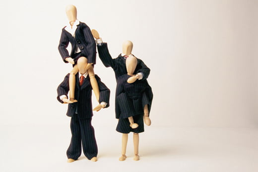 Businesspeople shoulder carrying