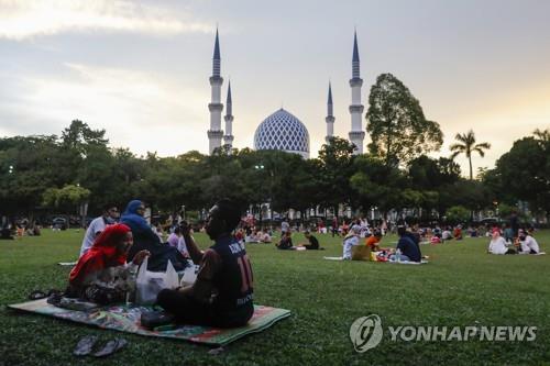 [월드&포토] 말레이시아, 코로나 엔데믹 향해 '활짝'