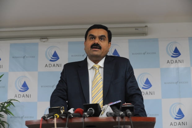  Gautam Adani, Chairman of the Adani Group speaks during a press conference in Ahmedabad on December 23, 2010. Adani Power Limited successfully synchronized India's first supercritical unit of 660 Megawatt at Mundra in Kutch district of Gujarat on December 22, 2010. The unit is the world's first Supercritical technology based project, which operate at higher temperatures and pressures and are 25 percent more efficient then conventional sub-critical power plants. AFP PHOTO / Sam PANTHAKY
/2010-12-23 22:03:19/
