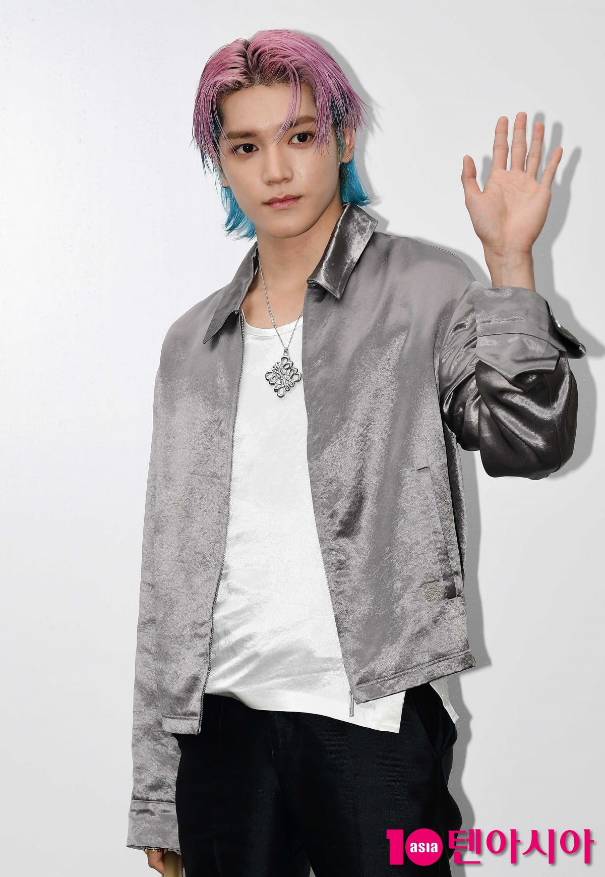 NCT Taeyong, the visual of a man tearing out of a cartoon...cool 