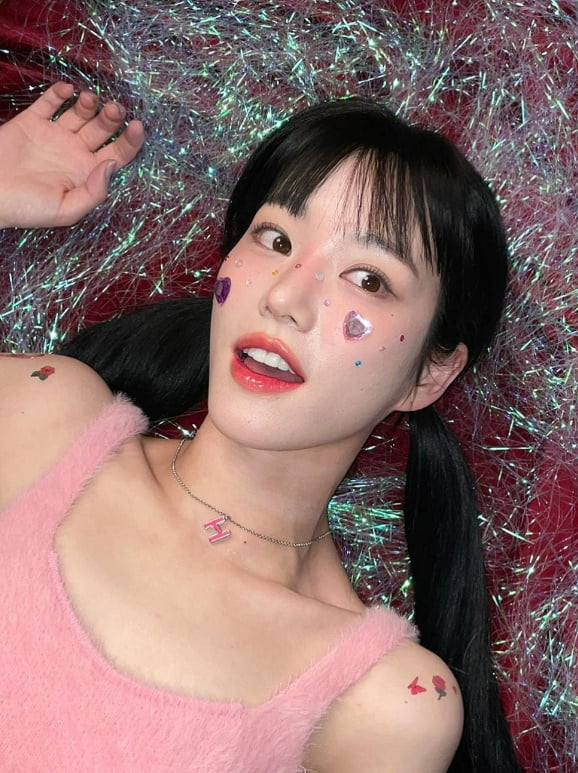 Yubi Lee, heart sticker, rose and butterfly tattoo and harlequin material