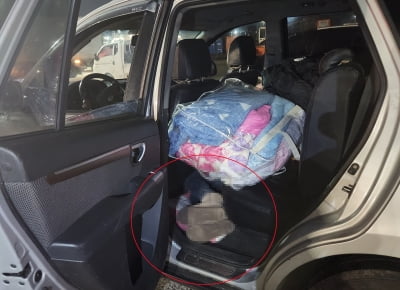 차량 뒷좌석 바닥에 숨어 제주 벗어나려한 중국인 구속 송치