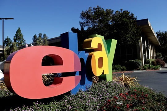 An eBay sign decorates the front of the company's headquarters in San Jose, Calif., Wednesday, Oct.  17, 2012. EBay said its third-quarter net income grew 22 percent, helped by higher revenue at its PayPal payments service and the marketplaces business that includes eBay.com. (AP Photo/Marcio Jose Sanchez)