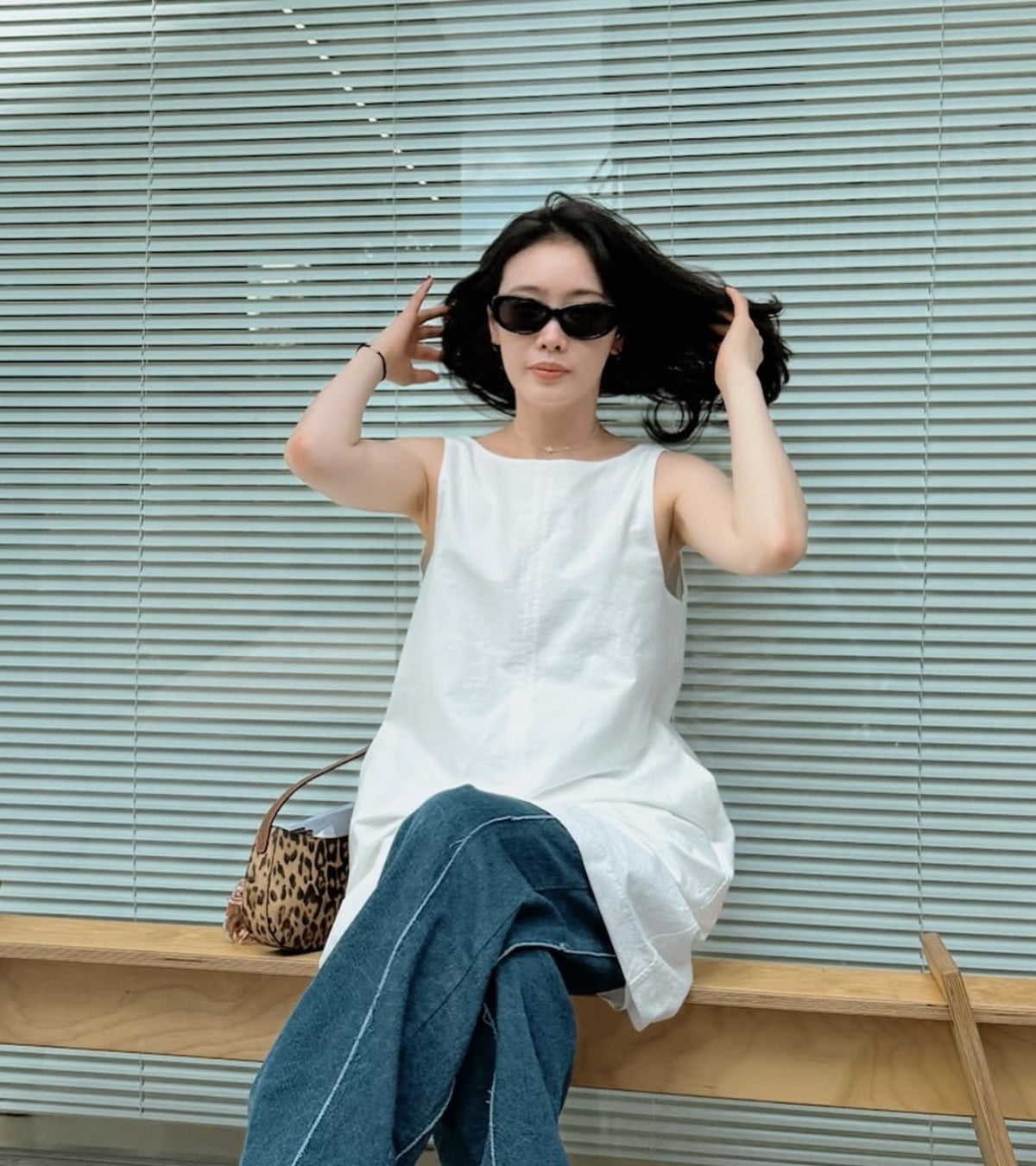 Kim Hieora Stuns in Chic Denim and Sunglasses Amidst Controversy