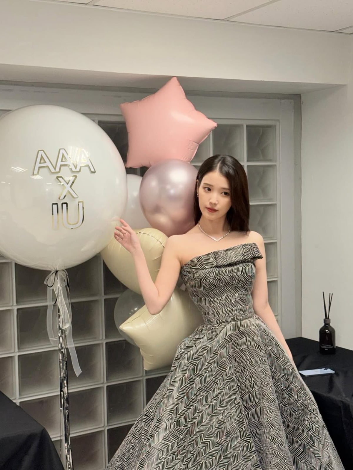 IU Captivates Fans with Behind-the-Scenes Photos from Asia Artist Awards